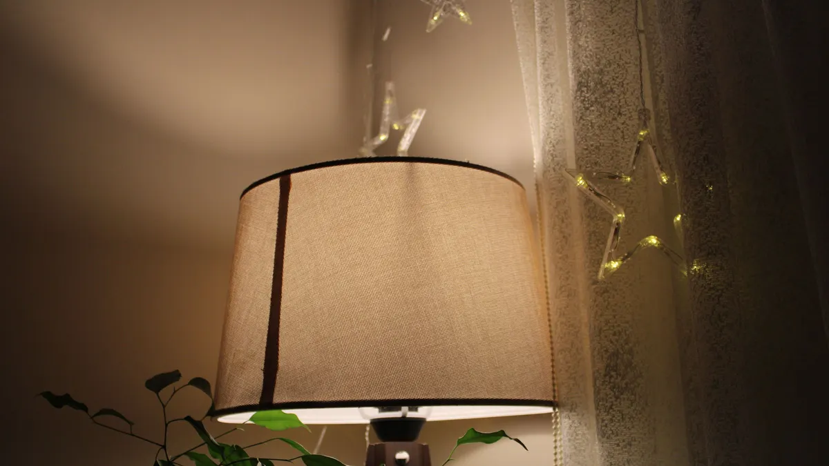 Table lamp glowing in a living room at night