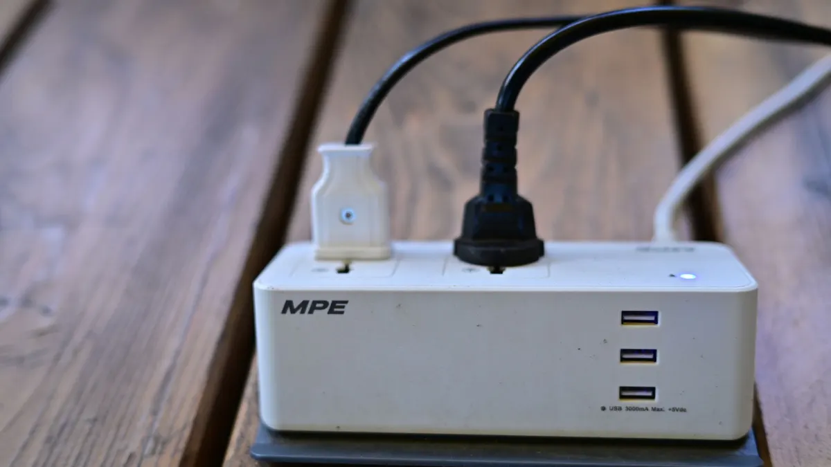 Power strip with USB ports and a plug connected