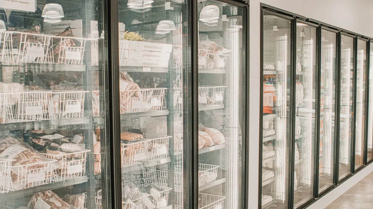 Glass-door freezers stocked with frozen food