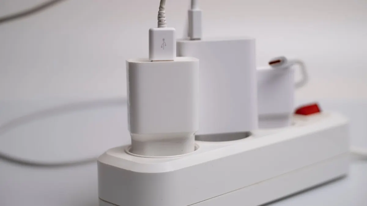 Several plugs connected to a white power strip