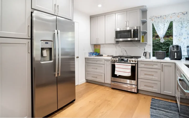 Bright kitchen with a stainless steel refrigerator and range