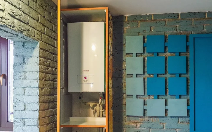 Water heater installed inside a cabinet in a modern home