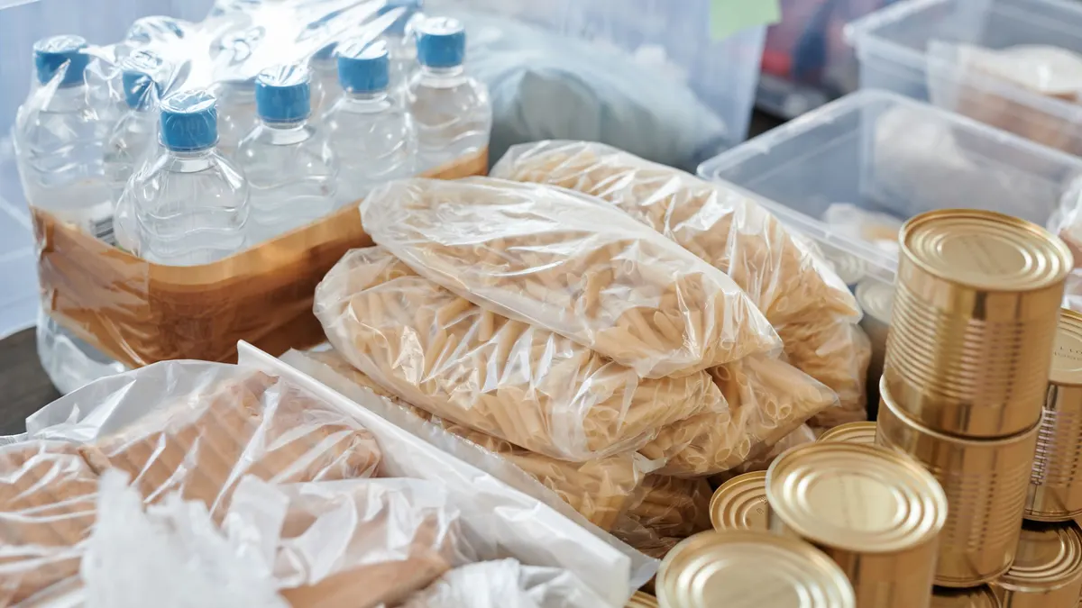 Bottled water, packaged food and canned goods stored together
