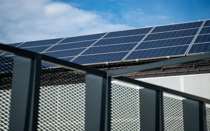 Solar panels mounted along a balcony railing