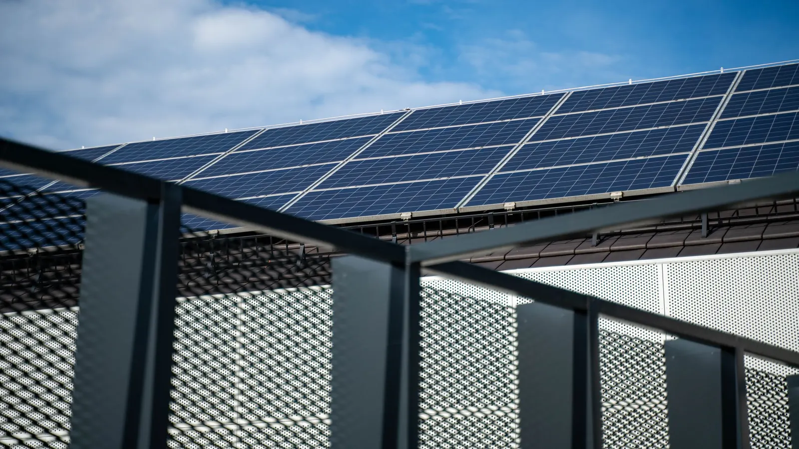 Solar panels mounted along a balcony railing