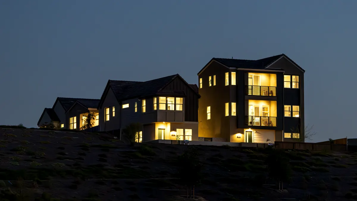 Modern homes with lights on at dusk