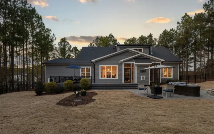Single-story house with a large yard at sunset