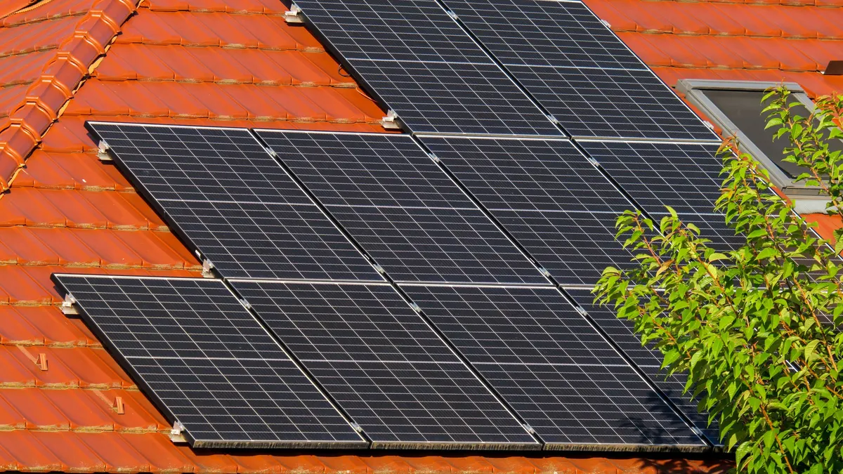 Solar panels on an orange tiled roof