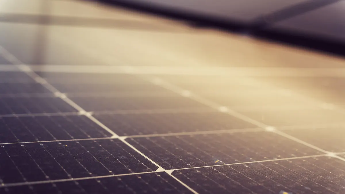 Close-up of solar panel cells in warm light
