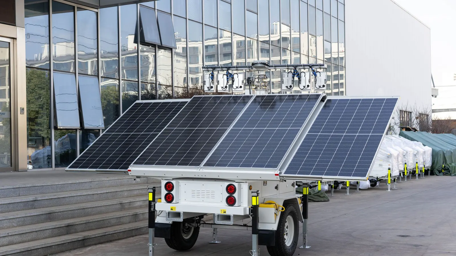 Trailer-mounted solar power unit with panels parked outdoors