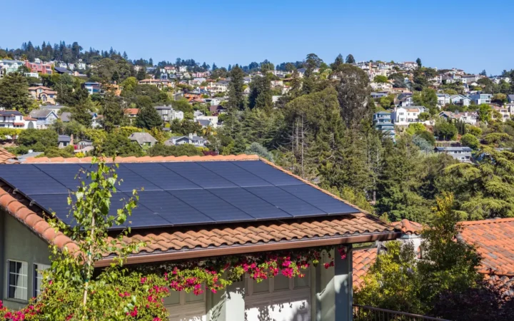 Hillside house with solar panels on a tiled roof