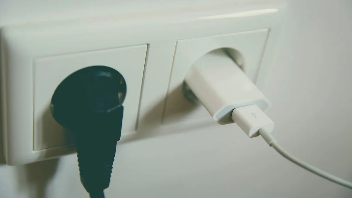 Close-up of a wall outlet with two plugs inserted